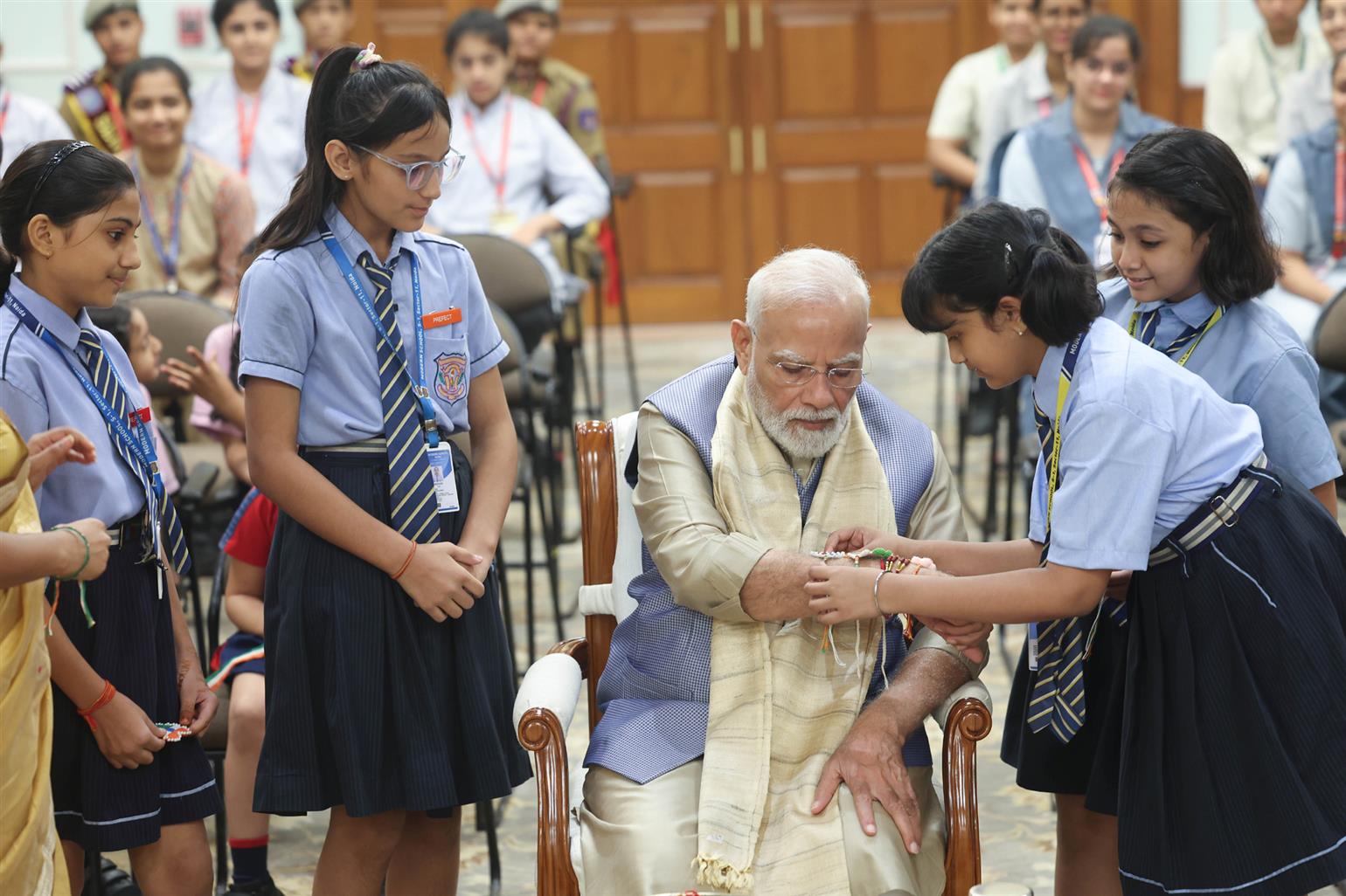 PM celebrates the festival of Raksha Bandhan with children from different schools at his residence (7, Lok Kalyan Marg), in New Delhi. 