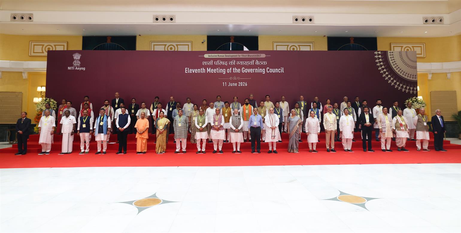 PM in a group photograph during the 11th NITI Aayog Governing Council Meeting, in New Delhi 