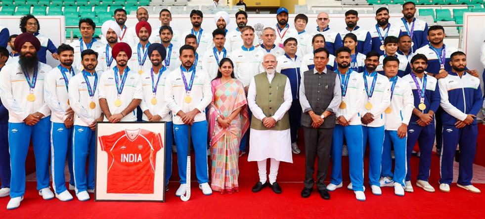 PM in a group photograph with the Indian Contingent for Asian Games 2026, in New Delhi 