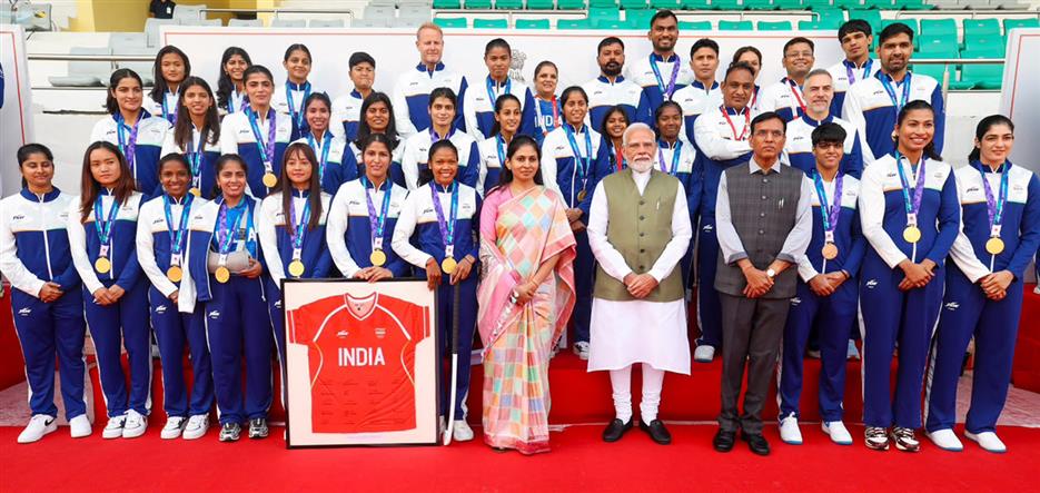 PM in a group photograph with the Indian Contingent for Asian Games 2026, in New Delhi 