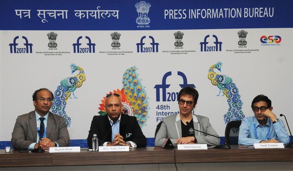 The High Commissioner of Canada to India, Mr. Nadir Patel, Filmmaker, Writer & Director Atom Egoyan at a Press Conference, during the 48th International Film Festival of India (IFFI-2017), in Panaji, Goa on November 27, 2017. The Film Festival Director, Shri Sunit Tandon is also seen. :Ministry of Information & Broadcasting