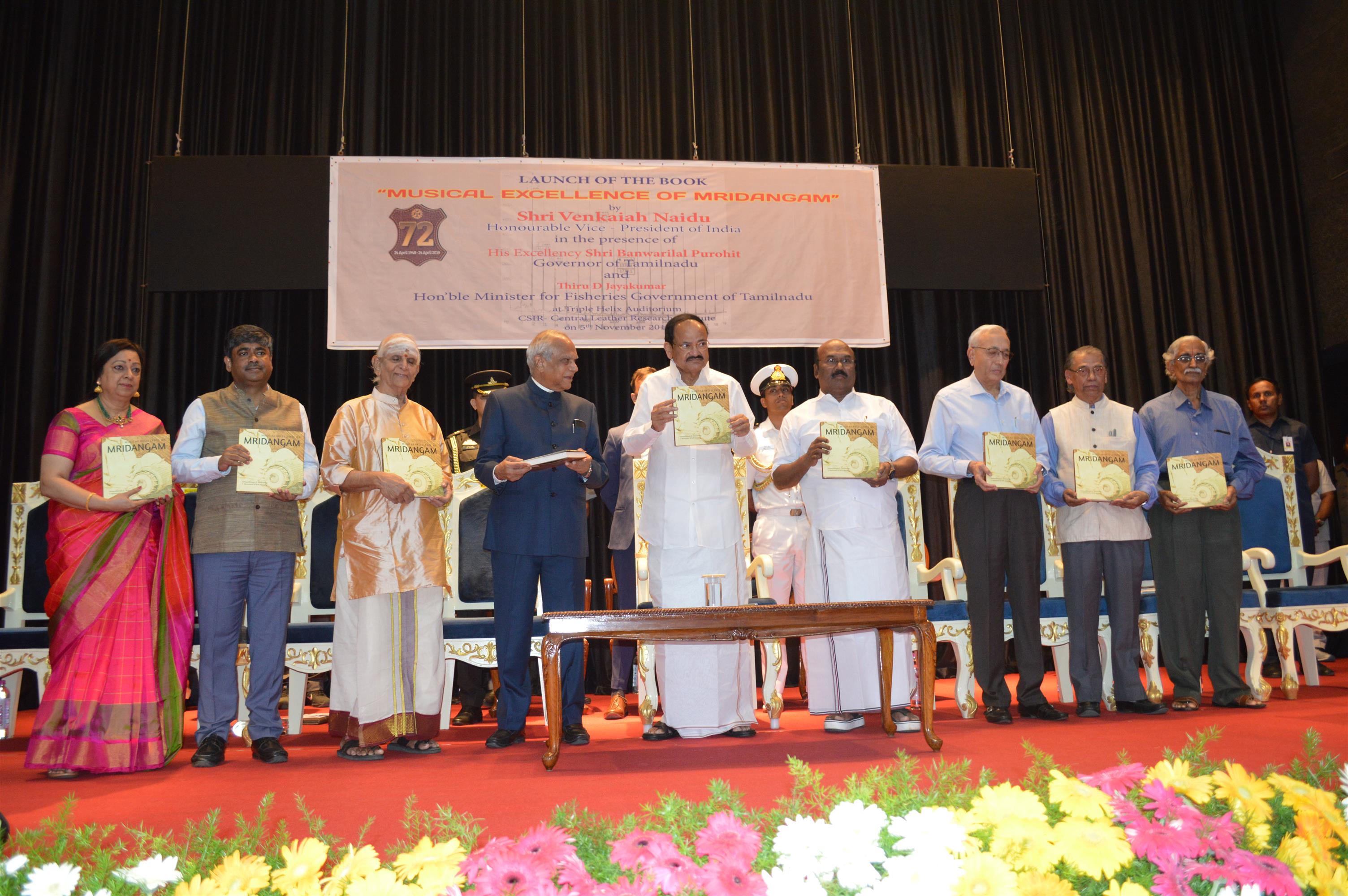 Vice President of India Shri M. Venkaiah Naidu releasing the monograph on 'Musical Excellence of Mridangam' at an event organised at CLRI Chennai. Tamil Nadu Governor Shri Banwarilal Purohit, State Fisheries Minister, Shri D. Jayakumar, and the authors of the book- noted Percussionist Dr Umayalpuram Sivaraman, Dr T. Ramasami, former Secretary, Dept of Science & Technology and Dr M. D. Naresh are seen. Director CLRI, Dr S. Kapuraia, Shri Murali of the Hindu Group of Publications and Carnatic Singer Smt Geetha Rajasekhar are also seen.
