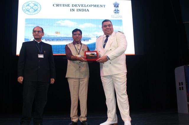 The Captain of cruise ship Costa Victoria  is presenting a plaque to Shri Mansukh L. Mandaviya , Minister of State (Independent Charge), Shipping  onboard Costa Victoria  at Mumbai Port on 08.11.19 , while Shri Sanjay Bhatia, Chairman, Mumbai Port Trust looks on. 