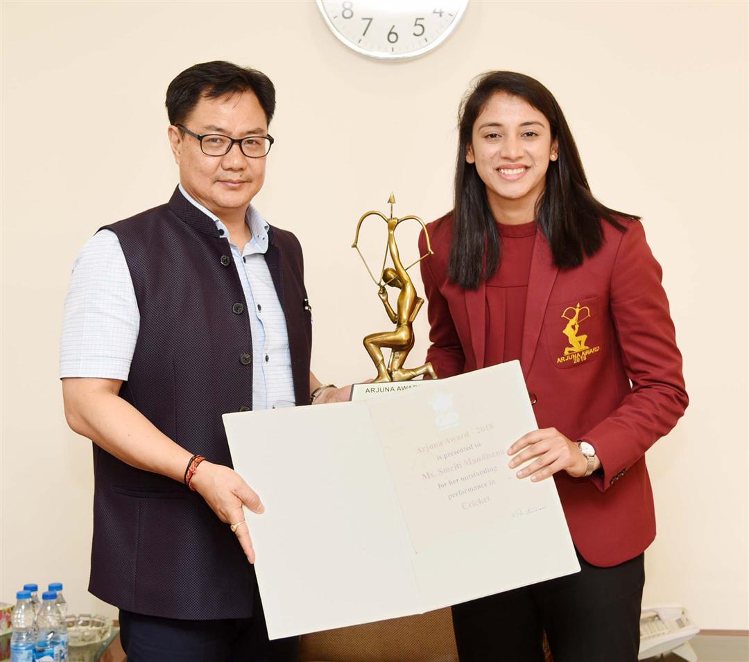 The Minister of State for Youth Affairs & Sports (Independent Charge) and Minority Affairs, Shri Kiren Rijiju conferring the Arjun Award to Ms. Smriti Mandhana (Cricket), in New Delhi on July 16, 2019.