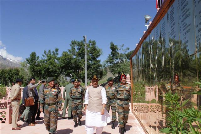 The Union Minister for Defence, Shri Rajnath Singh at the Kargil War Memorial, Dras, in Jammu and Kashmir on July 20, 2019. The Chief of Army Staff, General Bipin Rawat is also seen. 