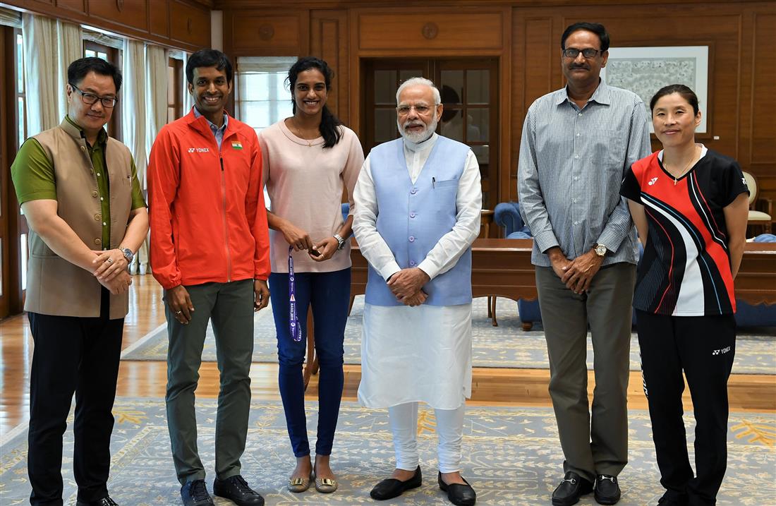 The World Champion, Shuttler P.V. Sindhu meeting the Prime Minister, Shri Narendra Modi, in New Delhi on August 27, 2019. The Minister of State for Youth Affairs & Sports (Independent Charge) and Minority Affairs, Shri Kiren Rijiju and other are also seen. 