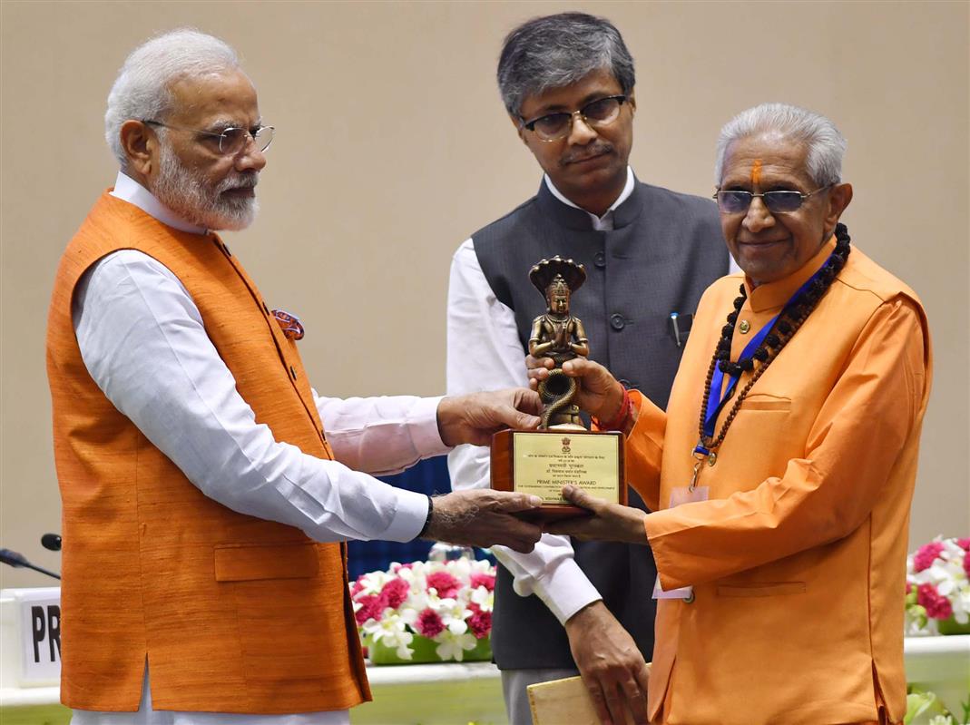 The Prime Minister, Shri Narendra Modi presenting Yoga awards to the winners of the Prime Minister’s Award for Outstanding Contribution for Promotion and Development of Yoga, at a function, in New Delhi on August 30, 2019. The Secretary, Ministry of AYUSH, Shri Vaidya Rajesh Kotecha is also seen. 