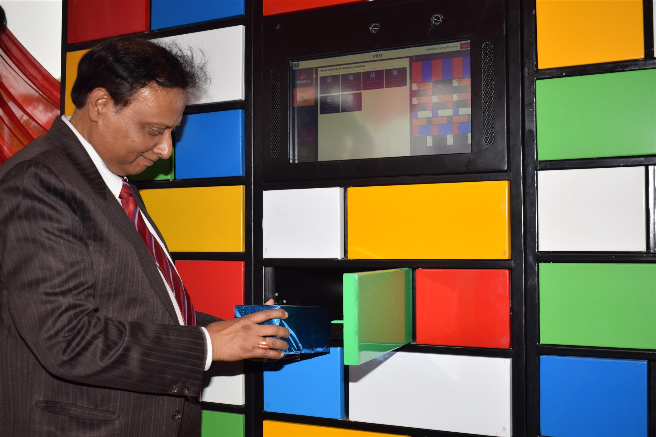 Sri Gautam Bhattacharya, Chief Post Master General, West Bengal Circle unveiling a Digital Parcel Locker Service, first of its kind in India, at Nabadiganta lT Post Office, CP Block, Sector V, Salt Lake, Kolkata on March 12, 2020.