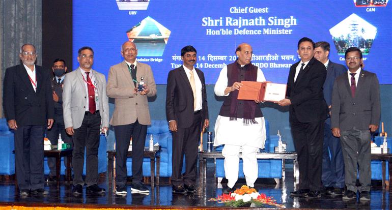 The Union Minister for Defence, Shri Rajnath Singh handing over the Defence Research and Development Organisation developed products to Armed Forces and other security agencies at an event, in New Delhi on December 14, 2021.
	The Secretary, Department of Defence R&D and Chairman, DRDO, Dr. G. Satheesh Reddy and other dignitaries are also seen.
