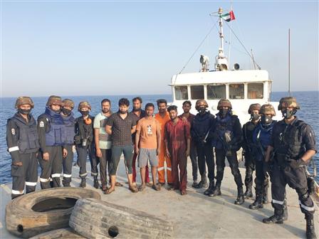 The crew of INS Talwar with the relieved crew of MV Nayan comprising seven Indians after successfully operationalising her machinery