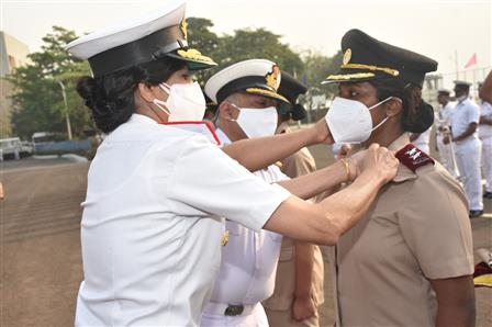 The Chief Guest Surgeon Rear Admiral Arti Sarin, Commanding Officer INHS Asvini pinning the stars on the shoulders of the nursing cadet signifying the cadet becoming an officer