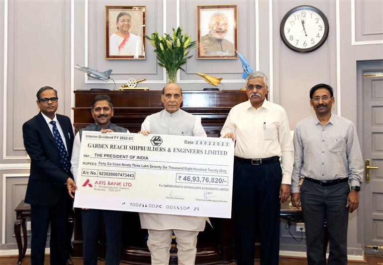 The Union Minister for Defence, Shri Rajnath Singh receiving an interim dividend cheque of Rs 46.93 crore for Financial Year 2022-23 from Chairman & Managing Director of Garden Reach Shipbuilders & Engineers Ltd Cmde PR Hari (Retd), in New Delhi on April 10, 2023. The Defence Secretary, Shri Giridhar Aramane is also seen.