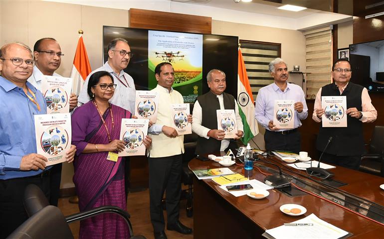 The Union Minister for Agriculture and Farmers Welfare, Shri Narendra Singh Tomar releasing SOPs for pesticide spray with drones and a booklet on millets machinery, in New Delhi on April 20, 2023. The Secretary, Ministry of Agriculture and Farmers Welfare, Shri Manoj Ahuja, and the Secretary, DARE & DG, ICAR, Dr. Himanshu Pathak are also seen.