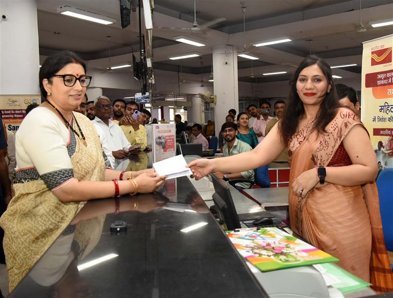 The Union Minister for Women & Child Development and Minority Affairs, Smt. Smriti Irani Opening Mahila Samman Saving Certificate (MSSC) account at Sansad Marg Post Office, in New Delhi on April 26, 2023.