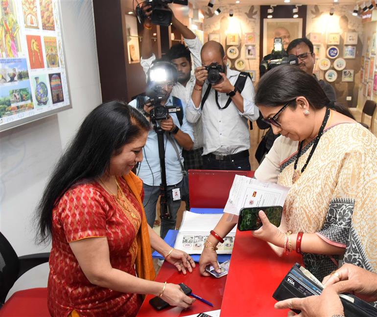 The Union Minister for Women & Child Development and Minority Affairs, Smt. Smriti Irani Opening Mahila Samman Saving Certificate (MSSC) account at Sansad Marg Post Office, in New Delhi on April 26, 2023.