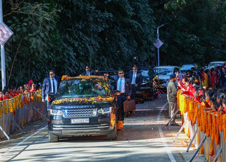 PM being welcomed by people on his arrival in Dehradun on December 08, 2023.