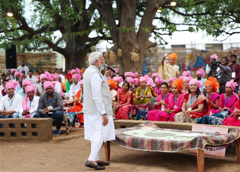 PM interacts with the tribal leaders, SHGs, PESA communities at Pakaria village in Shahdol, Madhya Pradesh on July 01, 2023.