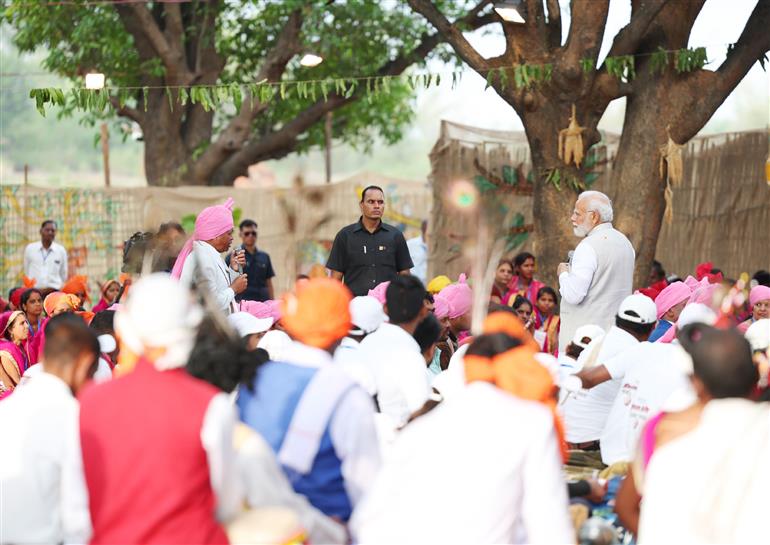 PM interacts with the tribal leaders, SHGs, PESA communities at Pakaria village in Shahdol, Madhya Pradesh on July 01, 2023.