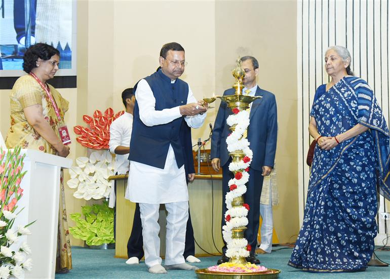 The Minister of State for Finance, Shri Pankaj Chaudhary lighting the lamp at the 164th anniversary of Income Tax Day celebrations in the presence of the Union Minister for Finance and Corporate Affairs, Smt. Nirmala Sitharaman at Vigyan Bhavan, in New Delhi on July 24, 2023.