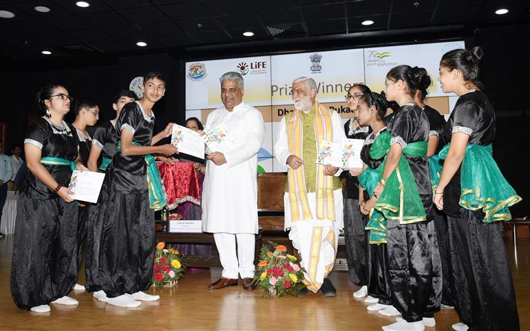The Union Minister for Environment, Forest & Climate Change, Labour & Employment, Shri Bhupender Yadav distributes winning awards to winners at Award Ceremony for Trash to Treasure Hackathon, Dharti Kare Pukaar, Youth Conclave & Inter-School Painting Competition on the eve of World Environment Day in the presence of the Minister of State for Consumer Affairs, Food & Public Distribution, Environment, Forest and Climate Change, Shri Ashwini Kumar Choubey at Indira Paryavaran Bhawan, in New Delhi on June 04, 2023.