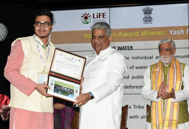 The Union Minister for Environment, Forest & Climate Change, Labour & Employment, Shri Bhupender Yadav distributes winning awards to winners at Award Ceremony for Trash to Treasure Hackathon, Dharti Kare Pukaar, Youth Conclave & Inter-School Painting Competition on the eve of World Environment Day in the presence of the Minister of State for Consumer Affairs, Food & Public Distribution, Environment, Forest and Climate Change, Shri Ashwini Kumar Choubey at Indira Paryavaran Bhawan, in New Delhi on June 04, 2023.