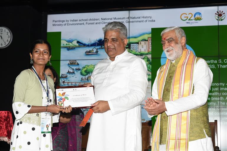 The Union Minister for Environment, Forest & Climate Change, Labour & Employment, Shri Bhupender Yadav distributes winning awards to winners at Award Ceremony for Trash to Treasure Hackathon, Dharti Kare Pukaar, Youth Conclave & Inter-School Painting Competition on the eve of World Environment Day in the presence of the Minister of State for Consumer Affairs, Food & Public Distribution, Environment, Forest and Climate Change, Shri Ashwini Kumar Choubey at Indira Paryavaran Bhawan, in New Delhi on June 04, 2023.