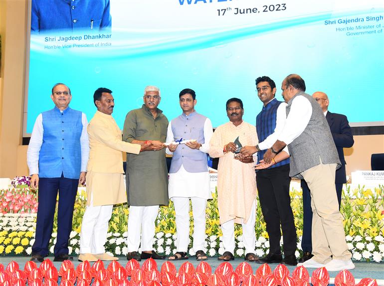 The Union Minister for Jal Shakti, Shri Gajendra Singh Shekhawat presenting prizes to winners in various categories at the 4th National Water Awards ceremony at Vigyan Bhawan, in New Delhi on June 17, 2023. The Minister of State for Tribal Affairs and Jal Shakti, Shri Bishweswar Tudu is also present.