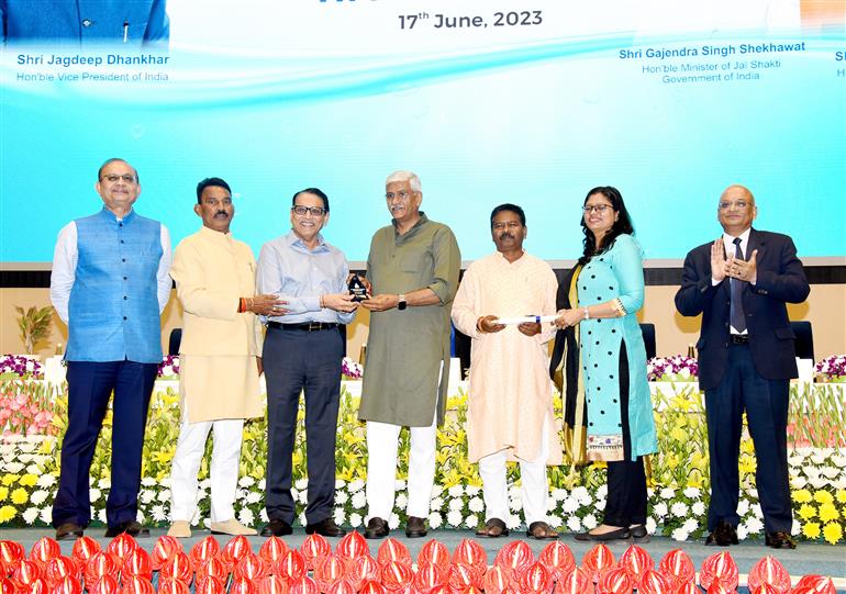 The Union Minister for Jal Shakti, Shri Gajendra Singh Shekhawat presenting prizes to winners in various categories at the 4th National Water Awards ceremony at Vigyan Bhawan, in New Delhi on June 17, 2023. The Minister of State for Tribal Affairs and Jal Shakti, Shri Bishweswar Tudu is also present.