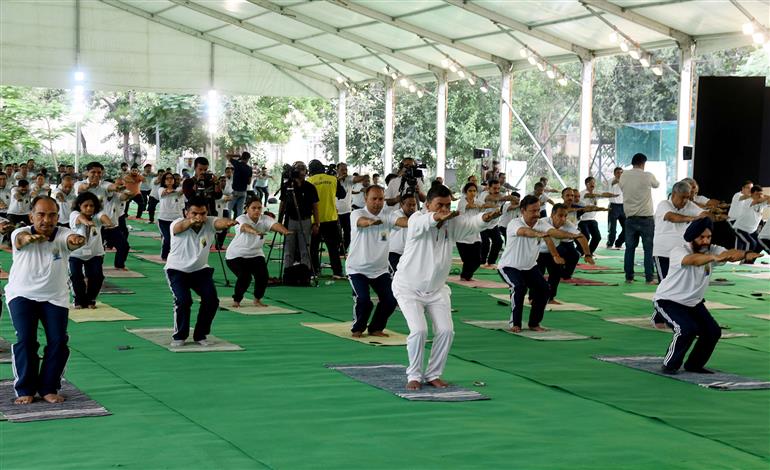The Union Minister for Power, New and Renewable Energy, Shri Raj Kumar Singh participates in Yoga on the occasion of 9th International Day of Yoga 2023 celebration, in New Delhi on June 21, 2023.:Ministry of Power