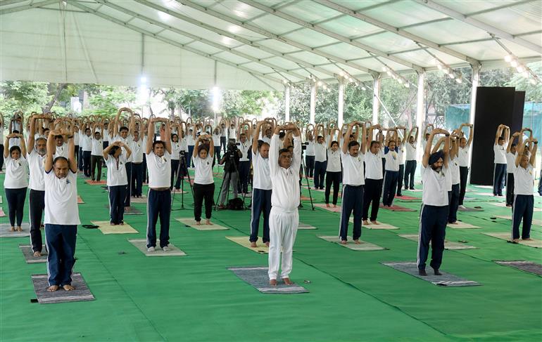 The Union Minister for Power, New and Renewable Energy, Shri Raj Kumar Singh participates in Yoga on the occasion of 9th International Day of Yoga 2023 celebration, in New Delhi on June 21, 2023.:Ministry of Power
