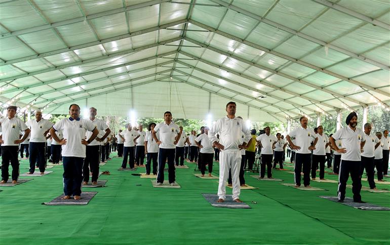The Union Minister for Power, New and Renewable Energy, Shri Raj Kumar Singh participates in Yoga on the occasion of 9th International Day of Yoga 2023 celebration, in New Delhi on June 21, 2023.:Ministry of Power