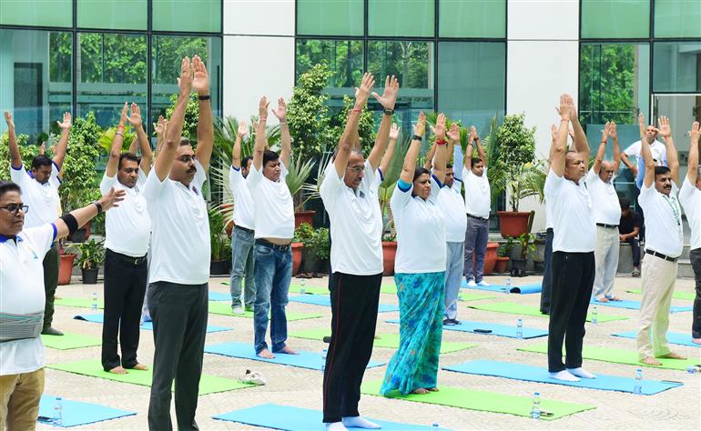 The Principal Director General, Mr. Rajesh Malhotra lead Senior officers and Staff of Press Information Bureau performs yoga on the occasion of 9th International Day of Yoga 2023 celebrations at National Media Centre, in New Delhi on June 21, 2023.:Ministry of Information & Broadcasting