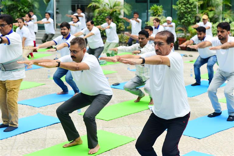 The Principal Director General, Mr. Rajesh Malhotra lead Senior officers and Staff of Press Information Bureau performs yoga on the occasion of 9th International Day of Yoga 2023 celebrations at National Media Centre, in New Delhi on June 21, 2023.:Ministry of Information & Broadcasting