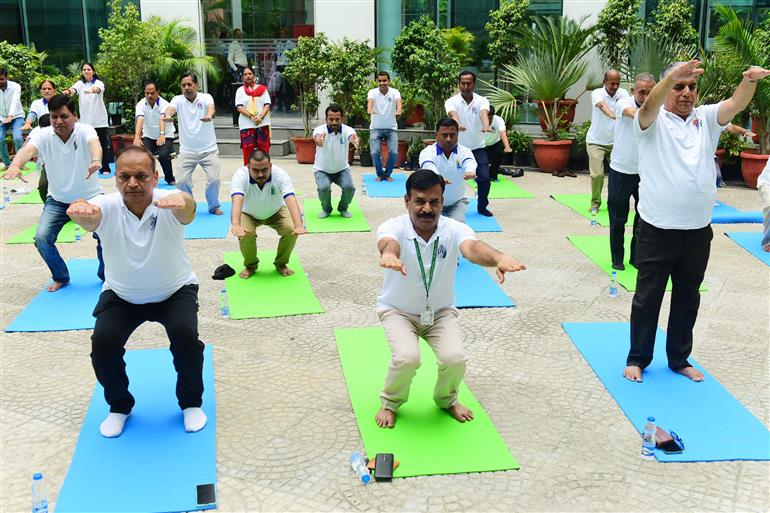 The Principal Director General, Mr. Rajesh Malhotra lead Senior officers and Staff of Press Information Bureau performs yoga on the occasion of 9th International Day of Yoga 2023 celebrations at National Media Centre, in New Delhi on June 21, 2023.:Ministry of Information & Broadcasting