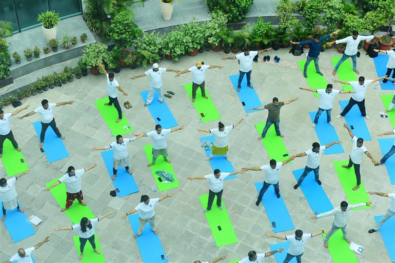 The Principal Director General, Mr. Rajesh Malhotra lead Senior officers and Staff of Press Information Bureau performs yoga on the occasion of 9th International Day of Yoga 2023 celebrations at National Media Centre, in New Delhi on June 21, 2023.:Ministry of Information & Broadcasting