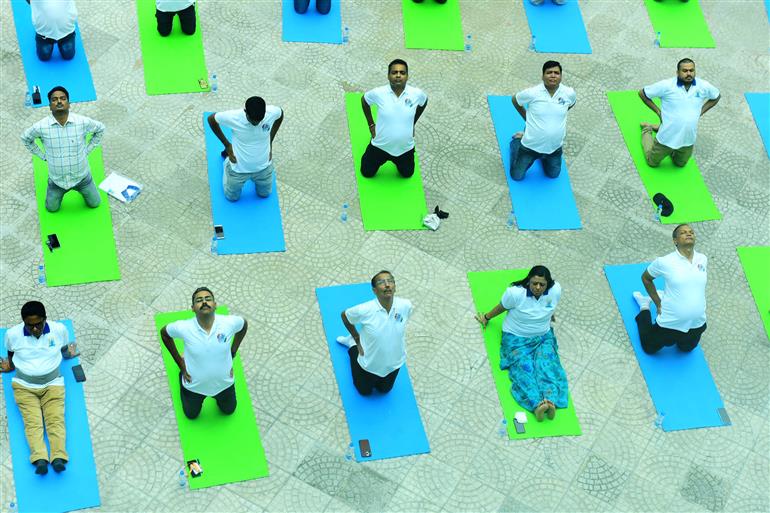 The Principal Director General, Mr. Rajesh Malhotra lead Senior officers and Staff of Press Information Bureau performs yoga on the occasion of 9th International Day of Yoga 2023 celebrations at National Media Centre, in New Delhi on June 21, 2023.:Ministry of Information & Broadcasting