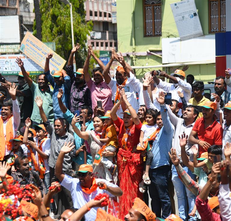 PM being welcomed by people at Mandya, in Karnataka on March 12, 2023.