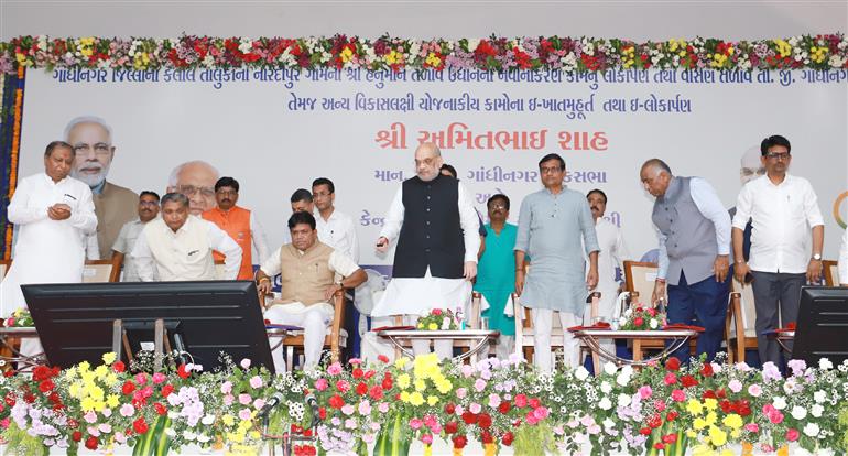 The Union Minister for Home Affairs and Cooperation, Shri Amit Shah lays the foundation stone of various development projects, in Kalol, Gujarat on March 18, 2023.