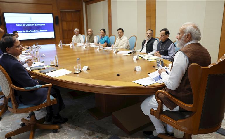 PM chairs a high-level meeting to review status and preparedness of public health response to Covid-19 & Influenza, in New Delhi on March 22, 2023.