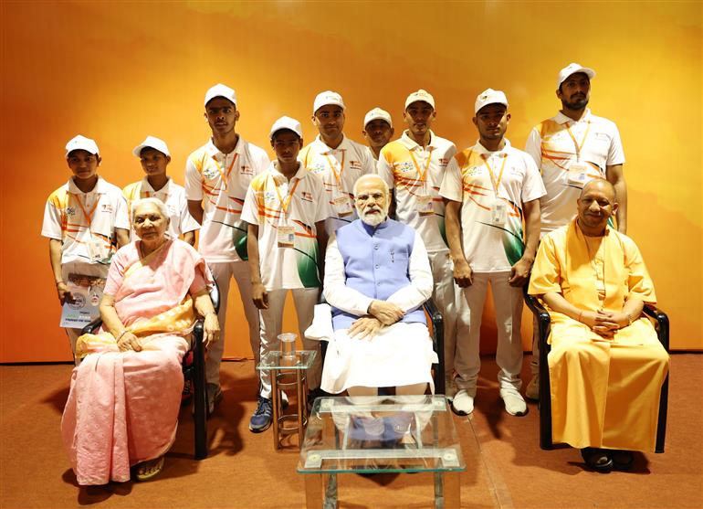 PM with the winners of Sansad khel pratiyogita at Varanasi, in Uttar Pradesh on March 24, 2023. 