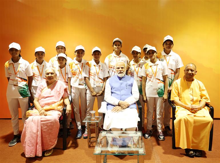 PM with the winners of Sansad khel pratiyogita at Varanasi, in Uttar Pradesh on March 24, 2023. 