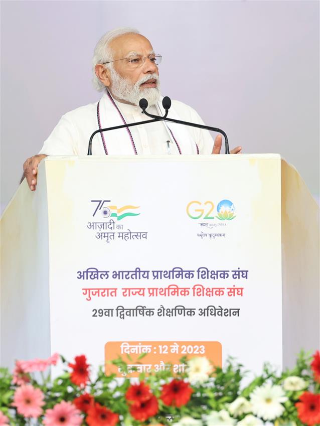 PM addressing at Akhil Bhartiya Shiksha Sangh Adhiveshan at Gandhinagar, in Gujarat on May 12, 2023.