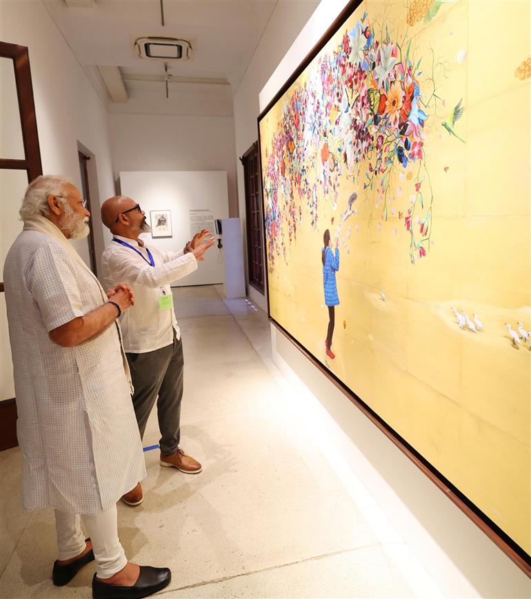 PM visits Jana Shakti exhibition at NGMA, in New Delhi on May 14, 2023.