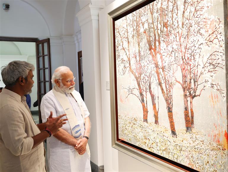 PM visits Jana Shakti exhibition at NGMA, in New Delhi on May 14, 2023.