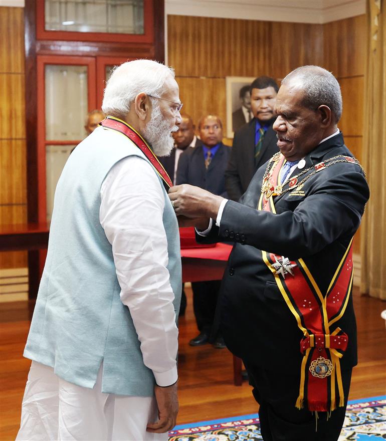 PM being conferred with Papua New Guinea Companion of the Order of Logohu by the Governor General of Papua New Guinea, Sir Bob Dadae at Port Moresby, in Papua New Guinea on May 22, 2023.