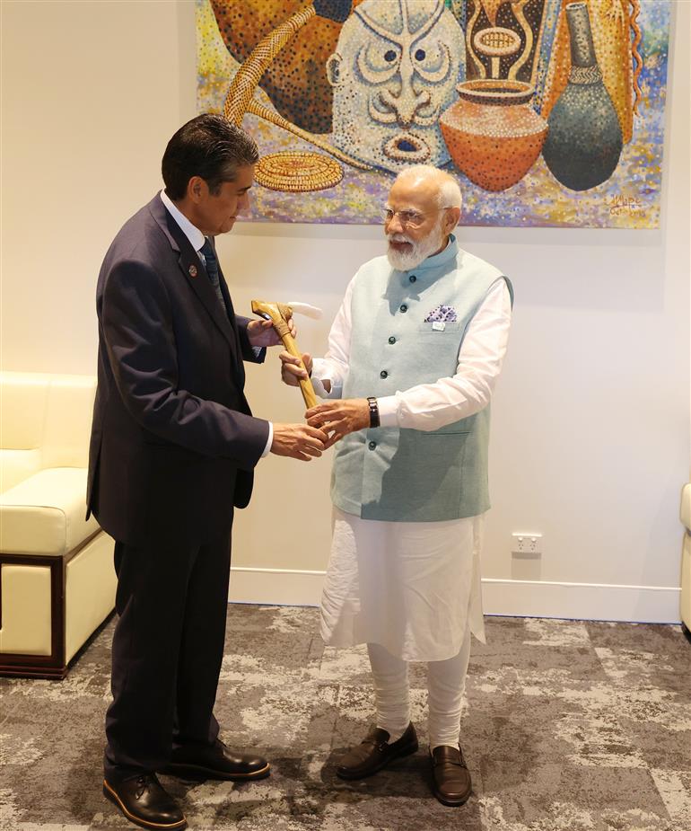 PM being conferred with Palau Ebakl Award by the President of the Republic of Palau, Mr. Surangel S. Whipps Jr. at Port Moresby, in Papua New Guinea on May 22, 2023.