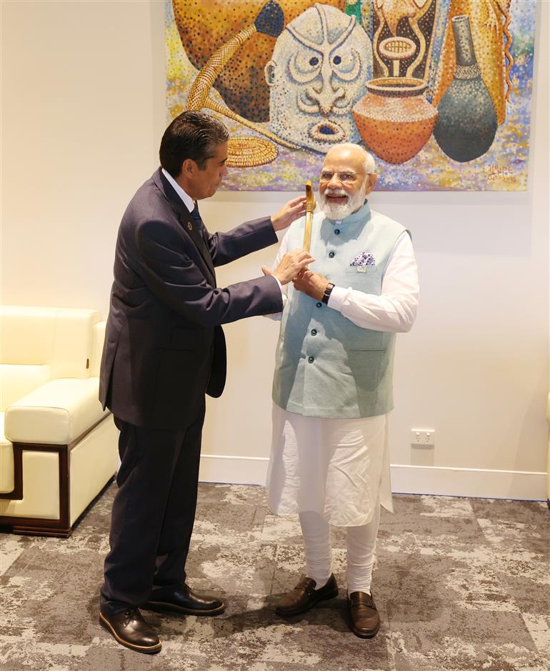 PM being conferred with Palau Ebakl Award by the President of the Republic of Palau, Mr. Surangel S. Whipps Jr. at Port Moresby, in Papua New Guinea on May 22, 2023.