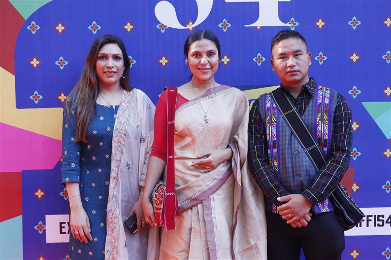 Filmmaker Shilpika Bordoloi along with the Crew- Researcher PC Lalrin Dika at the red carpet in the 54th IFFI for the screening of her film "Mau:The Spirit Dreams of Cheraw", in Goa on November 22, 2023.