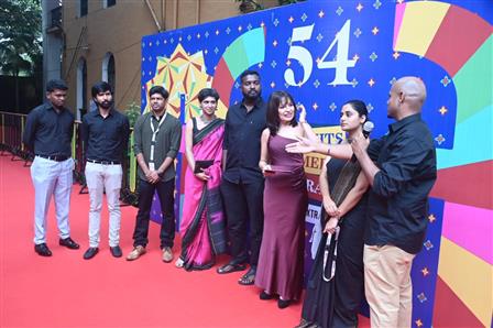 The Cast and crew of Indian panorama feature film "Neela Nira Sooriyan" on the red carpet at 54th IFFI, in Goa on November 26, 2023.