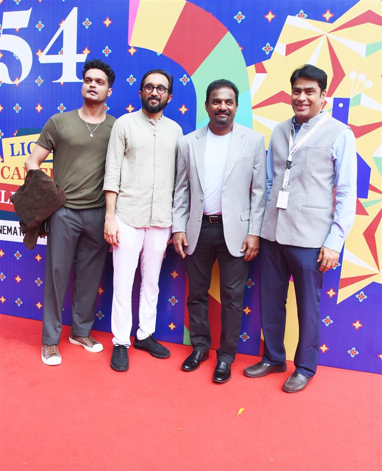 Muthaiah Muralidharan with the cast and crew of “800 The Movie” on the red carpet at 54th IFFI, in Goa on November 26, 2023.